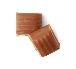 Tasty sweet caramel candies isolated on white, top view