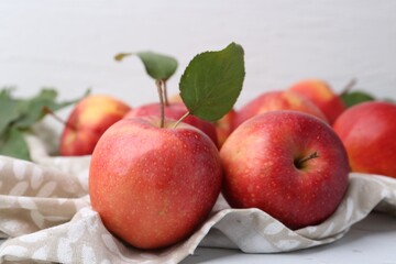 Whole ripe red apples on white table, closeup