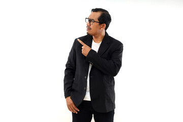 Displeased Confused businessman in suit pointing and looking sideways