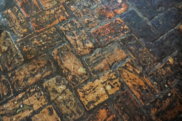 Background of old cobblestones. Floor of noble houses in colonial times.