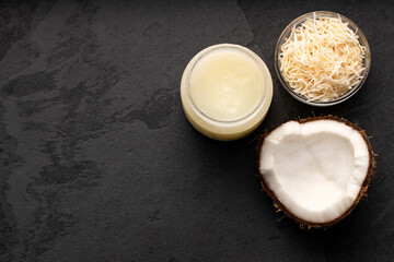 Bowl with oil and grated coconut - Cocos nucifera.