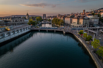 Beautiful aerial view of the city of Zurich in Switzerland - the Limmat River and its iconic churches, buildings rivers and Clockes.
