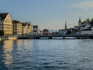 Beautiful aerial view of the city of Zurich in Switzerland - the Limmat River and its iconic churches, buildings rivers and Clockes.