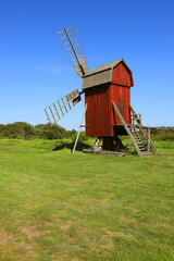Traditional red painted windmill located in the Swedish province of Oland.