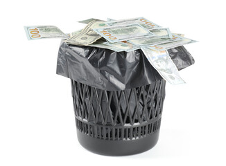 Many dollar banknotes in trash bin isolated on white