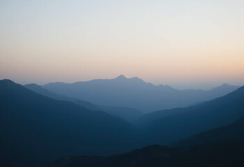 Fototapeta premium mountain peaks meet gentle fading light serene peaceful evening atmosphere