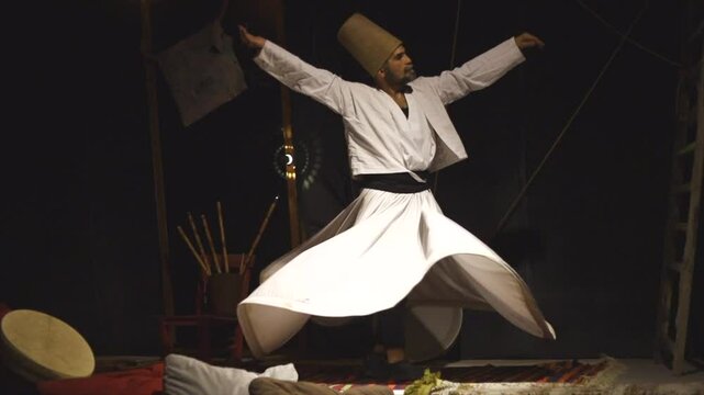 the image of a whirling Dervish in the darkness