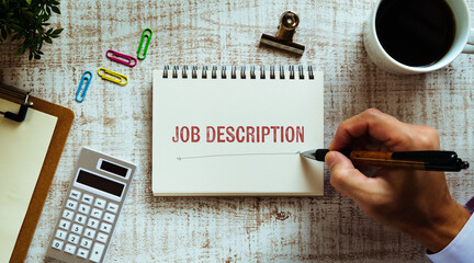There is notebook with the word Job Description. It is as an eye-catching image.