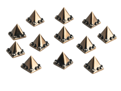 Metallic pyramid rivets isolated on isolated background. Twelve small, square, metallic objects in grid pattern. Triangle shape with pointed top, flat base. Metallic sheen, evenly spaced, symmetrical
