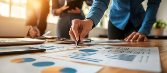 Professional team working on financial projections and strategy using advanced digital tools and interactive reports