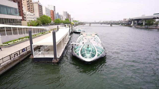 Hotaluna boat in center of Tokyo, futuristic looking cruise boat. Popular tourism destination and iconic Japanese landmark. 