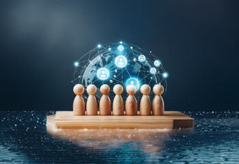 A group of wooden figures stand on a platform with a glowing globe and interconnected people icons above, highlighting a concept of global connection.