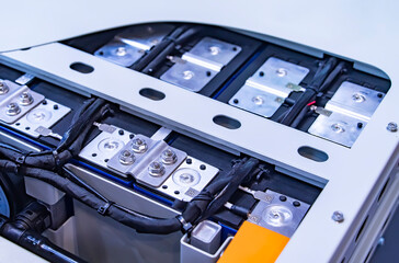 Obraz premium Electric vehicle lithium NMC battery for EV car energy storage. Lithium-ion cell pack or High voltage electric vehicle batteries.