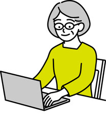 パソコンに向かう年配の女性