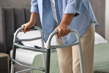 Senior woman with walking frame at home, closeup