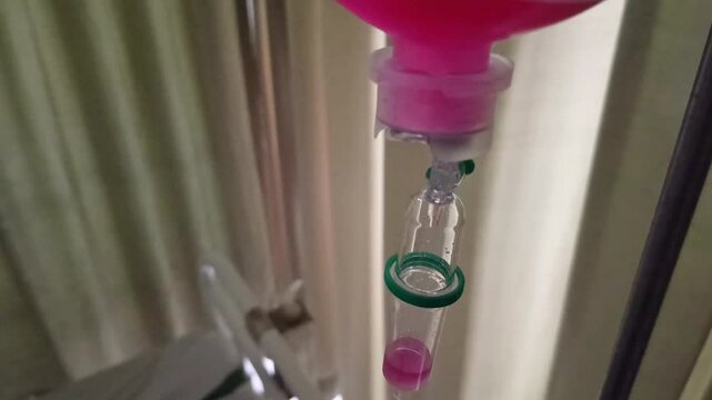high angle Normal saline solution (NSS) bag and infusion pump for patient in patient room in hospital, Saline drip in hospital room. Intravenous vitamin drip in hospital room.