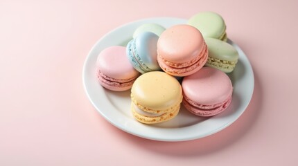 Obraz premium Plate of colorful pastel macarons on a white porcelain plate with soft lighting