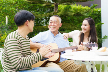 Happy multi-generation Asian family living together in weekend