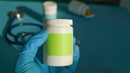 pharmacist with bottle of medicine at pharmacy