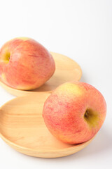 Fresh ripe apple with tiny water drops on white background