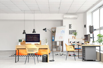 Interior of light programmer's office with desks and beanbags