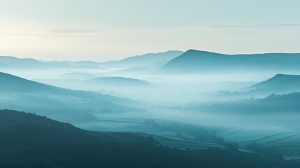 Obraz premium As dawn breaks, a serene mist envelops the valley, creating a tranquil atmosphere. The soft hues of morning light illuminate the rolling hills and dense foliage.