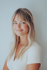 Fototapeta premium Smiling woman with blonde hair, white background