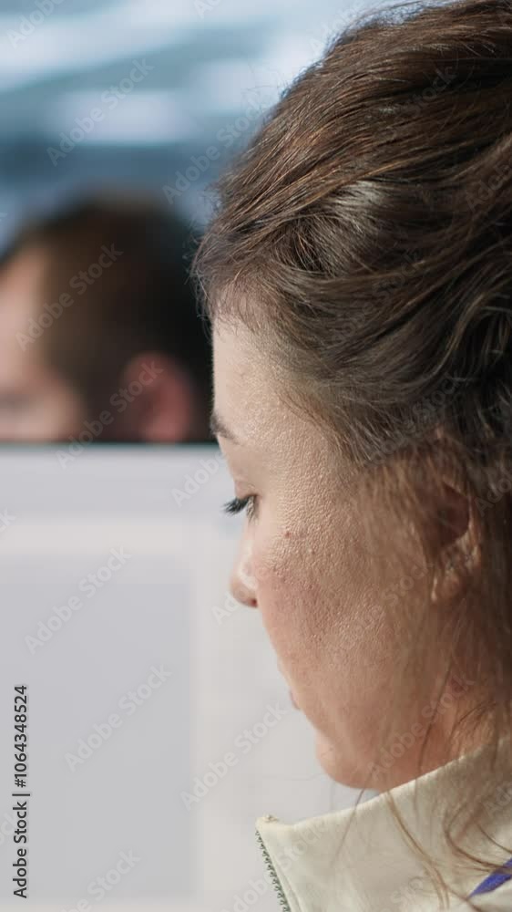 Poster smiling it engineer in data center using pc to find misconfigurations affecting rackmounts. cheerful