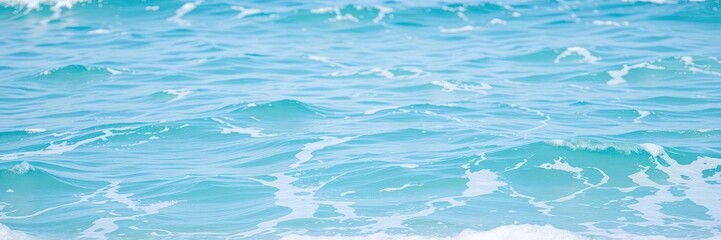 Obraz premium Close-up shot of pure blue turquoise ocean water with frothy foam and rolling waves, beauty, aqua, vacation