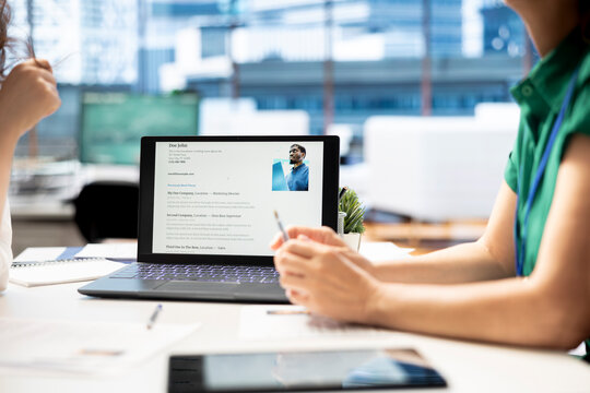 Notebook on office desk used by HR expert vetting applicants to ensure skills match role needs. Close up shot of laptop used by headhunter assessing candidate work experience