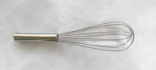 metal whisk designed to blend, beat, and stir ingredients quickly and efficiently, metal whisks are known for durability and strength, idealtasks like whipping egg whites, mixing batters