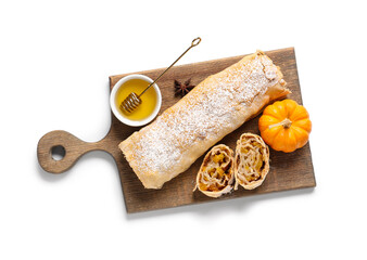 Wooden board with tasty pumpkin strudel and bowl of honey on white background