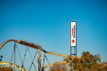 Naklejka premium Roller coasters at Canada's Wonderland. Canada's Wonderland is amusement park. Vaughan, Canada - November 2, 2024.