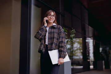 A confident businesswoman on a professional call, demonstrating the dynamics of the modern workplace