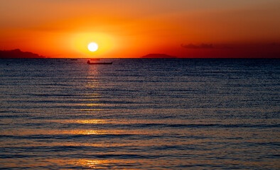 Sunrise over the sea in the early summer morning.