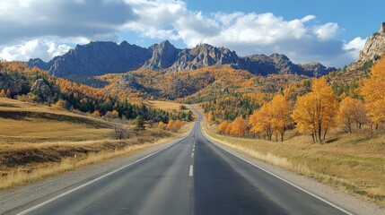 Fototapeta premium Road in mountains at sunny day in golden autumn. Landscape with empty highway through the mountain