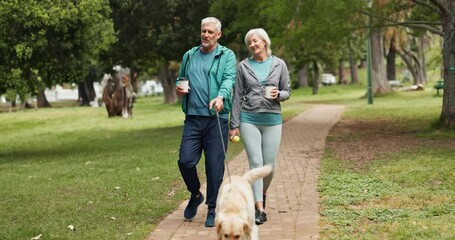 Couple, dog and walking in park with coffee, care and love in morning with smile with memory. Mature man, woman and pet animal with conversation, drink and exercise on path for wellness in England - Powered by Adobe