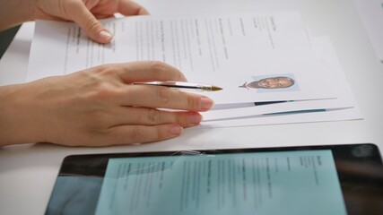 Team of recruiters selecting candidates based on their resumes, looking for the right person to fill in job vacancy. HR staff evaluating the qualifications of applicants after interview. Camera A.