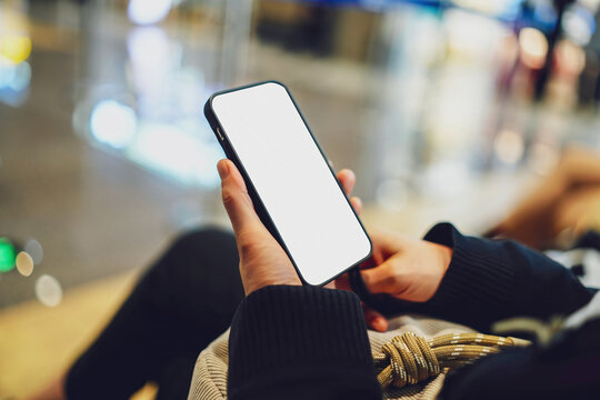Engaged User Holding a Smartphone in a Modern Environment