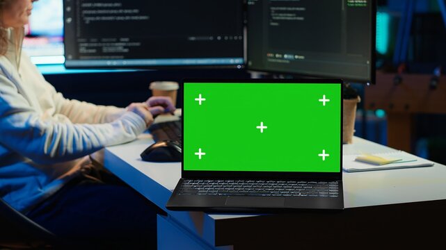 Programmer designing and developing software applications using isolated screen laptop. IT professional implementing and maintaining company systems using mockup notebook, camera A