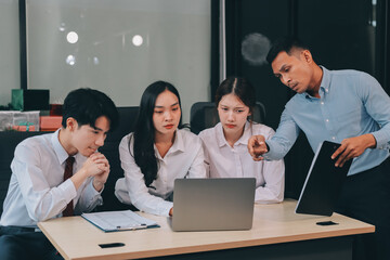 Frustrated upset multiracial business team people sad with bad work result in report disappointed in corporate bankruptcy failure crisis worried of paperwork problem sit at table at office meeting