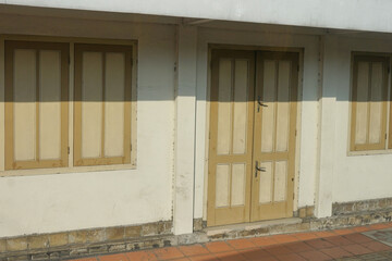 view of an old wooden door and windows