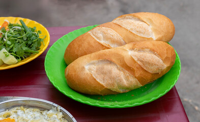 Vietnamese traditional bread for the breakfast. Freshly baked baguette isolated. Banh mi vietnam. Vietnam street food
