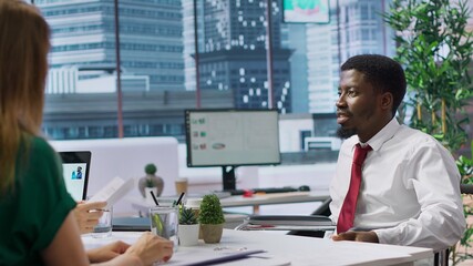 Job applicant in a wheelchair participate at interview with HR team, company advocating for workforce equality and inclusion. Job seeker applying for a position within a corporation. Camera A.