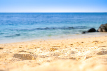 Nature of the beach and sea Summer with sunshine, sandy beaches, clear blue waters sparkling against the blue sky. On an island with good ecology and environment Background for summer vacation