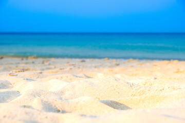 Nature of the beach and sea Summer with sunshine, sandy beaches, clear blue waters sparkling against the blue sky. On an island with good ecology and environment Background for summer vacation