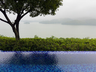 Tianmu Lake in a foggy day viewed from the pond at Hantian Teahouse in Liyang, Jiangsu, China.