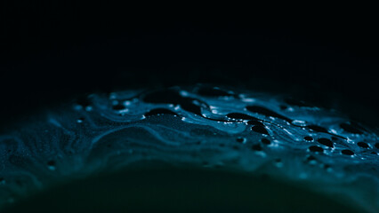 Clear water. Ruined hole. Set of caves in pure transparent crushed bright ice with cracks on modern art black darkened background.