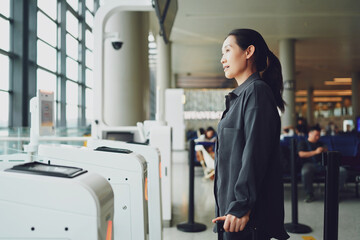 Thoughtful Traveler at Airport Checkpoint: A Moment of Anticipation