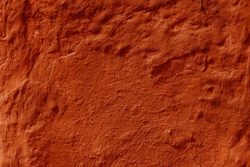 Grunge lush lava concrete background. Textured plaster wall. Creative backdrop for your design. Color of the year 2025 concept. Top view, layout for design. Surface with peeling shabby pattern.